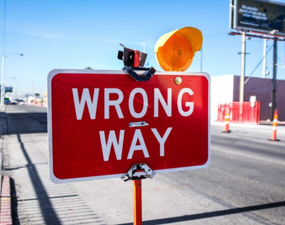 red Wrong Way signage on road